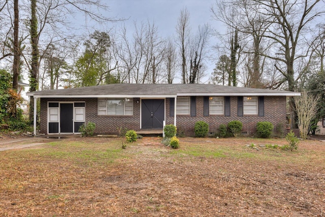 ranch-style house with a front lawn