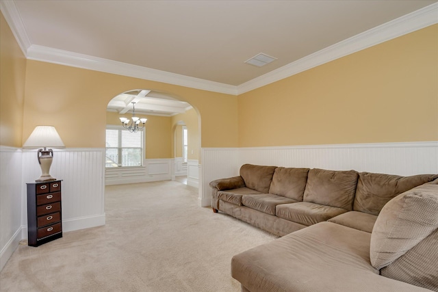 3051 Parkridge Dr, Grovetown, GA 30813 - living area featuring crown molding, arched walkways, a chandelier, light colored carpet, and wainscoting