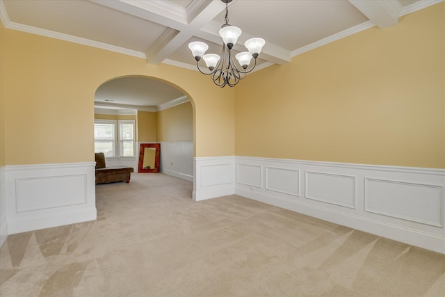 3051 Parkridge Dr, Grovetown, GA 30813 - spare room featuring arched walkways, a chandelier, beamed ceiling, coffered ceiling, and a wainscoted wall