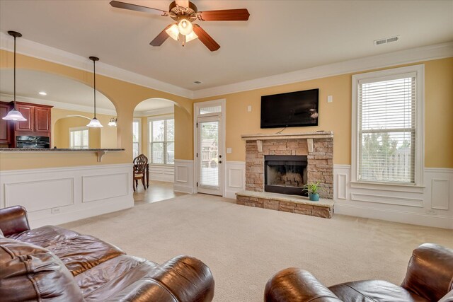 3051 Parkridge Dr, Grovetown, GA 30813 - living room with a wainscoted wall, carpet floors, a decorative wall, arched walkways, and crown molding