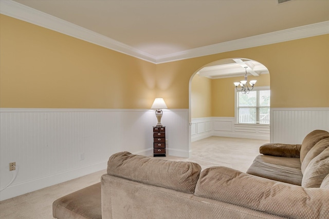 3051 Parkridge Dr, Grovetown, GA 30813 - living room with arched walkways, light carpet, a chandelier, a wainscoted wall, and ornamental molding