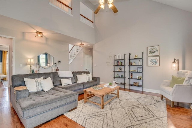 4002 Backwater Ct, Evans, GA 30809 - living area featuring a high ceiling, ceiling fan, wood finished floors, and stairway