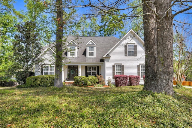 4002 Backwater Ct, Evans, GA 30809 - new england style home featuring a front lawn, fence, and roof with shingles