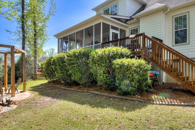 4002 Backwater Ct, Evans, GA 30809 - rear view of house with a sunroom, a yard, fence, stairs, and roof with shingles