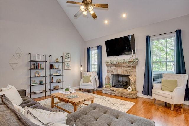 4002 Backwater Ct, Evans, GA 30809 - living room featuring wood finished floors, high vaulted ceiling, a ceiling fan, and a wealth of natural light