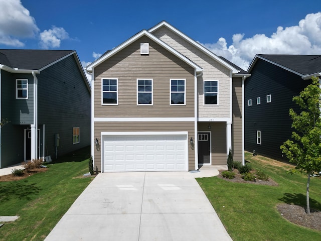 view of front of home featuring a front yard and a garage