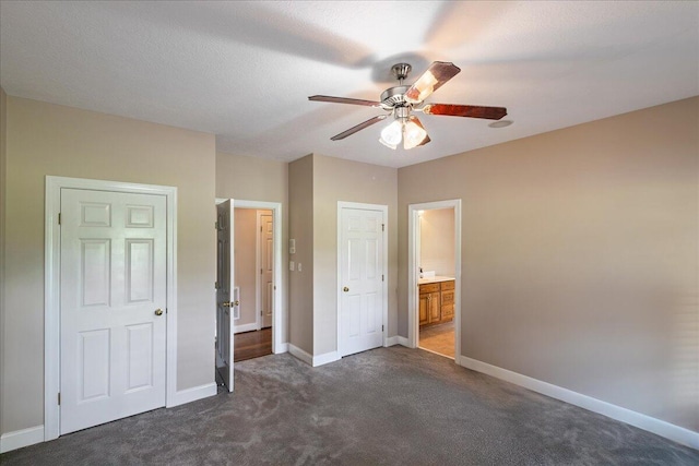 698 Heggies Ridge Dr, Appling, GA 30802 - unfurnished bedroom featuring dark carpet, baseboards, ensuite bathroom, and a ceiling fan