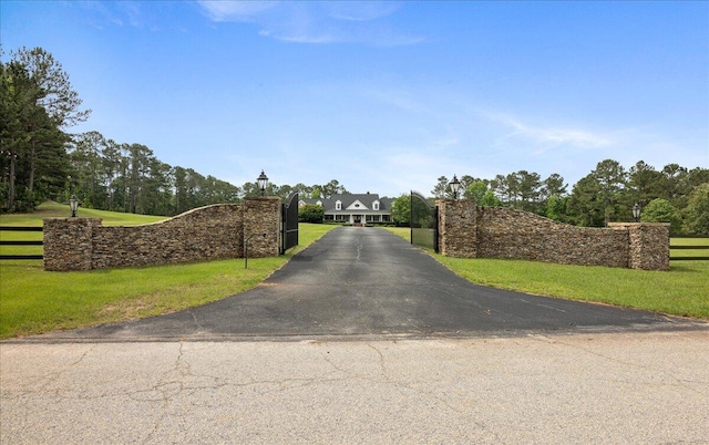 698 Heggies Ridge Dr, Appling, GA 30802 - view of asphalt driveway with a gated entry