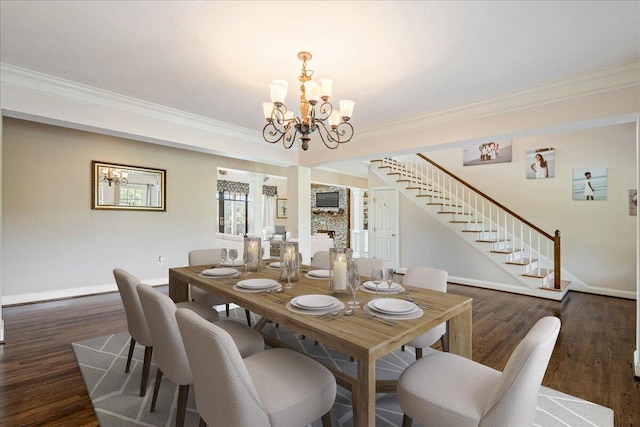 698 Heggies Ridge Dr, Appling, GA 30802 - dining area with a chandelier, ornamental molding, baseboards, stairs, and wood finished floors