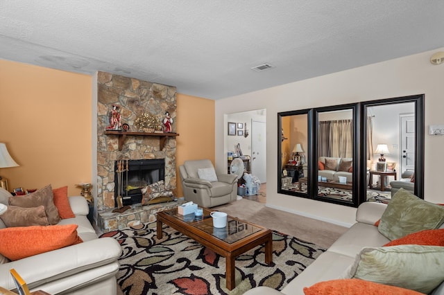3415 Pine Hill Rd, Hephzibah, GA 30815 - living area with carpet floors, a textured ceiling, and a stone fireplace