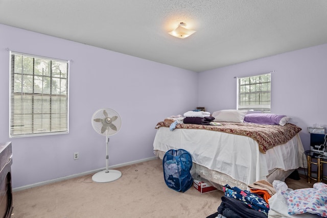 3415 Pine Hill Rd, Hephzibah, GA 30815 - carpeted bedroom with baseboards and a textured ceiling