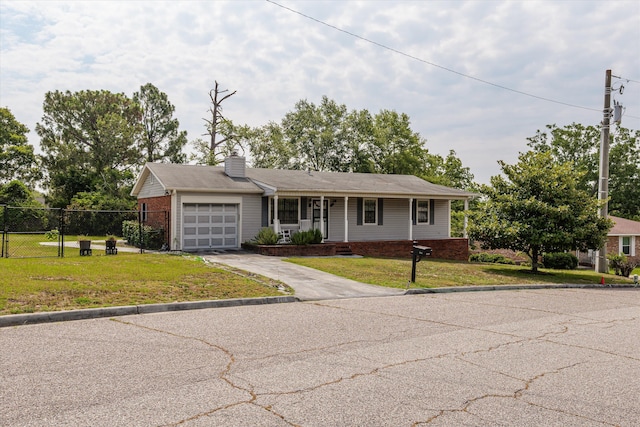 3415 Pine Hill Rd, Hephzibah, GA 30815 - ranch-style home with an attached garage, driveway, covered porch, a chimney, and brick siding