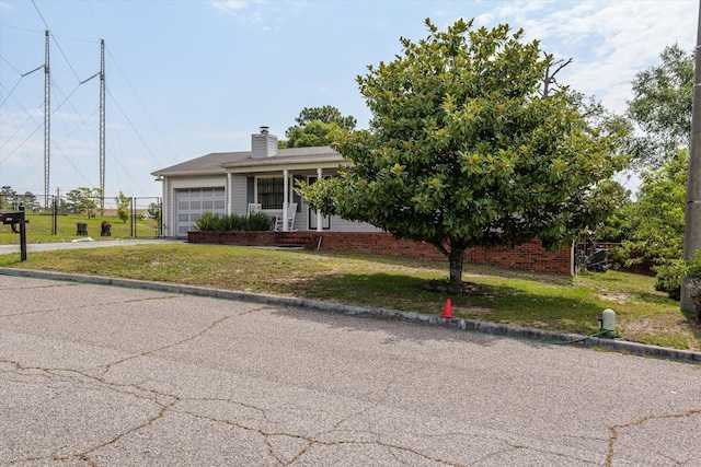 3415 Pine Hill Rd, Hephzibah, GA 30815 - view of front of house with a garage, a front yard, a chimney, and driveway