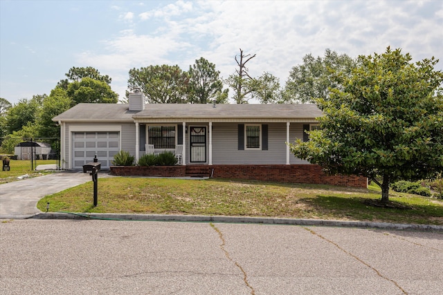 3415 Pine Hill Rd, Hephzibah, GA 30815 - single story home featuring an attached garage, a front yard, driveway, a chimney, and covered porch