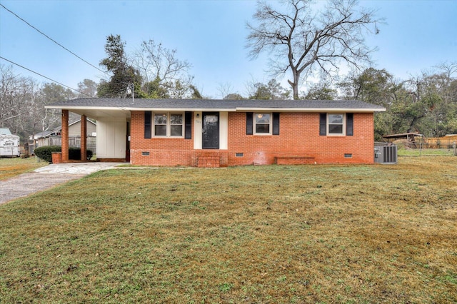 ranch-style home with a carport, central AC, and a front yard