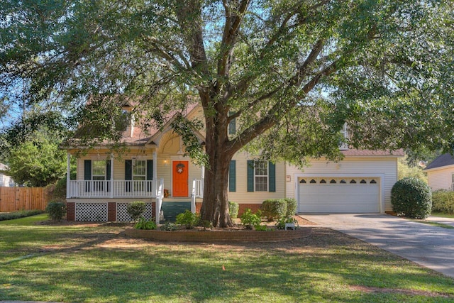 view of property hidden behind natural elements with a front lawn, a porch, and a garage