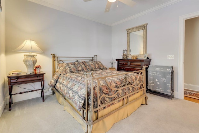 bedroom with ornamental molding, carpet, and ceiling fan