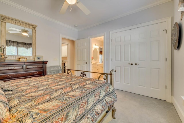 carpeted bedroom featuring ornamental molding, ceiling fan, and a closet