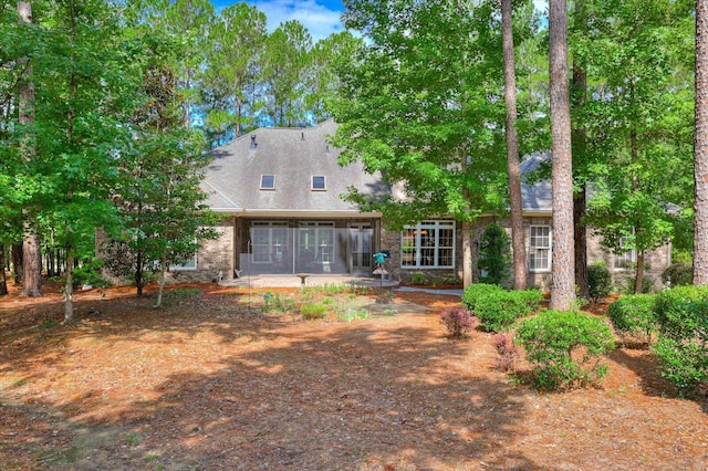 rear view of property featuring a patio