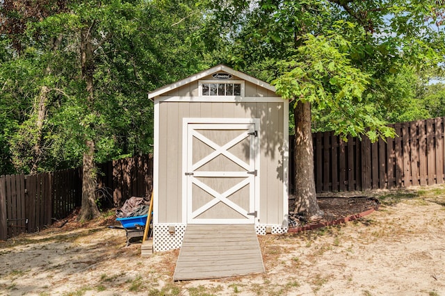 view of shed with a fenced backyard