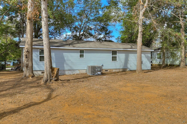 back of property with central AC unit