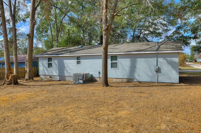 view of side of home featuring central air condition unit