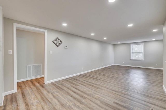 spare room with light wood-type flooring