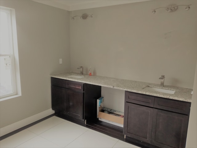 bathroom with tile patterned flooring and vanity