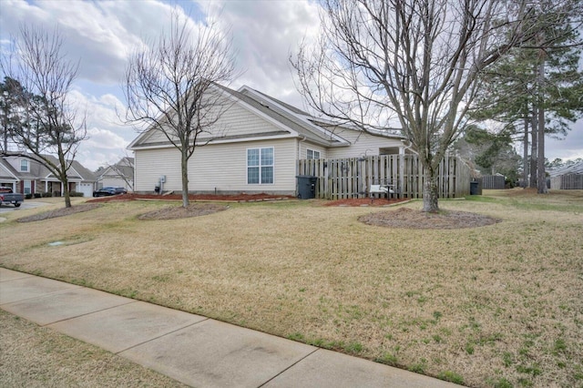 exterior space with a front yard and fence