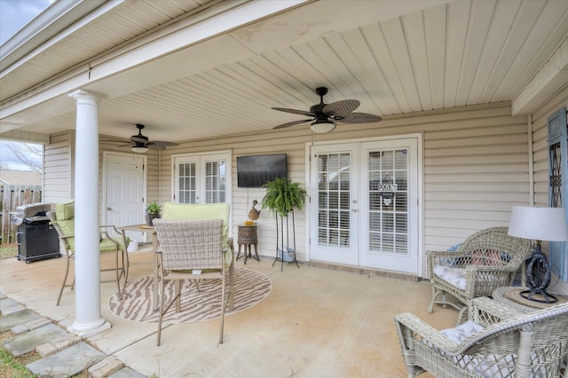 view of patio featuring french doors, a grill, ceiling fan, and outdoor dining area