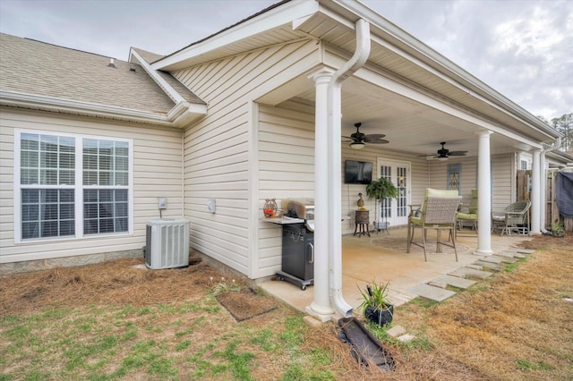 view of patio / terrace with ceiling fan and central AC