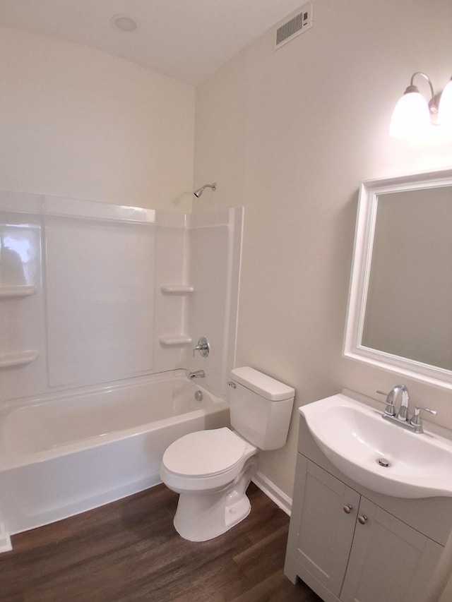 1540 Mill St, Augusta, GA 30901 - full bathroom with visible vents, vanity, wood finished floors, toilet, and  shower combination