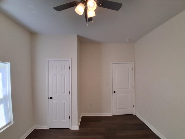1540 Mill St, Augusta, GA 30901 - empty room with baseboards, a wealth of natural light, a ceiling fan, and dark wood-type flooring