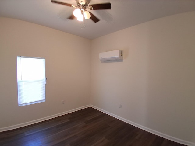 1540 Mill St, Augusta, GA 30901 - empty room featuring a ceiling fan, baseboards, dark wood-type flooring, and a wall mounted air conditioner