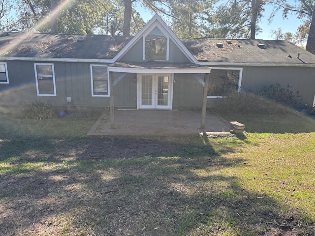 back of property featuring a lawn, a patio area, and french doors