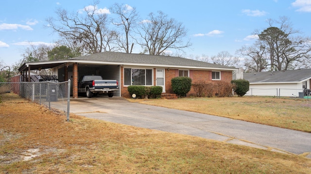 ranch-style home featuring driveway, fence, an attached carport, and brick siding