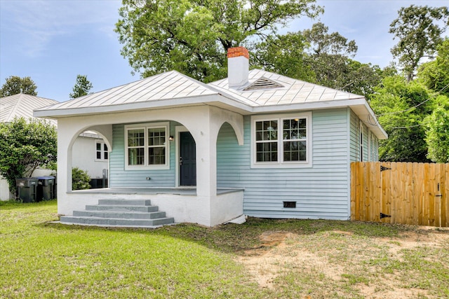 1107 Adrian St, Augusta, GA 30904 - view of front of home with a standing seam roof, a chimney, a porch, and metal roof