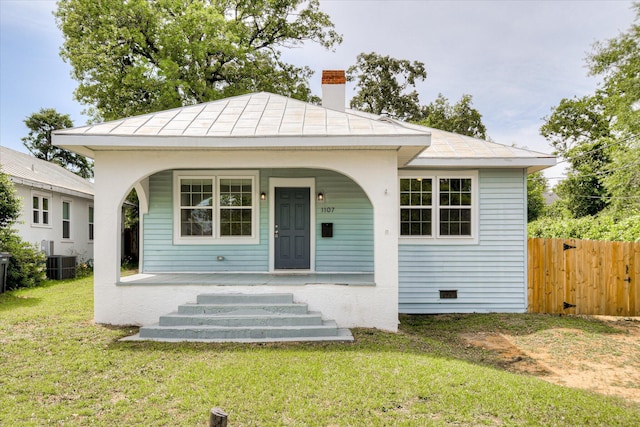 1107 Adrian St, Augusta, GA 30904 - view of front of house with a porch, central AC unit, and a chimney