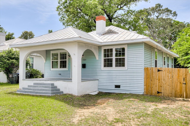 1107 Adrian St, Augusta, GA 30904 - view of front of home featuring covered porch, a chimney, a standing seam roof, and metal roof