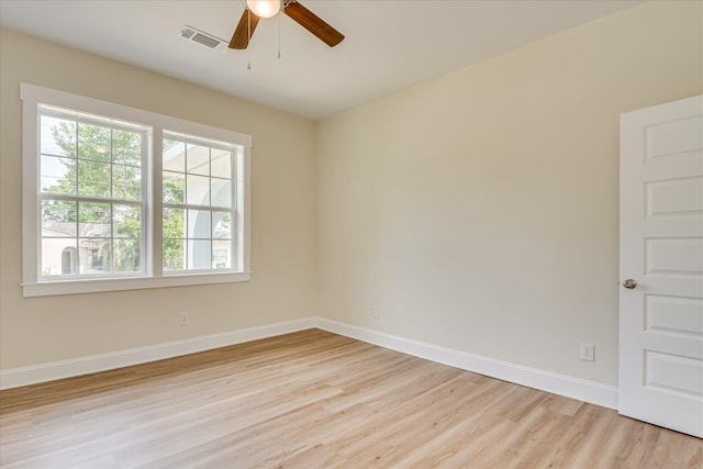 1107 Adrian St, Augusta, GA 30904 - spare room featuring light wood-style flooring, healthy amount of natural light, a ceiling fan, and baseboards