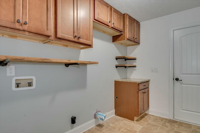 702 Southwick Ave, Grovetown, GA 30813 - clothes washing area with baseboards, hookup for a washing machine, and cabinet space