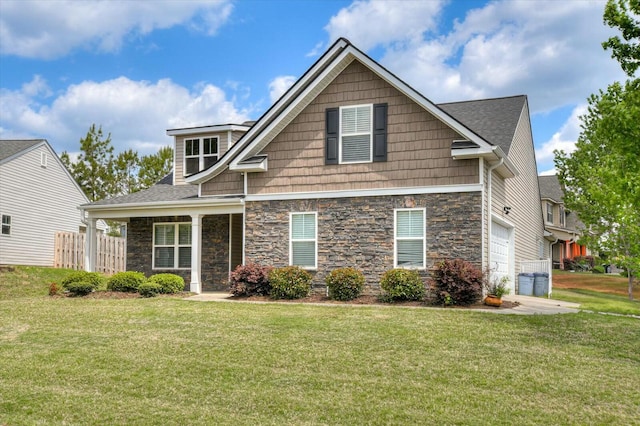 702 Southwick Ave, Grovetown, GA 30813 - craftsman-style home featuring a front lawn, stone siding, and a garage