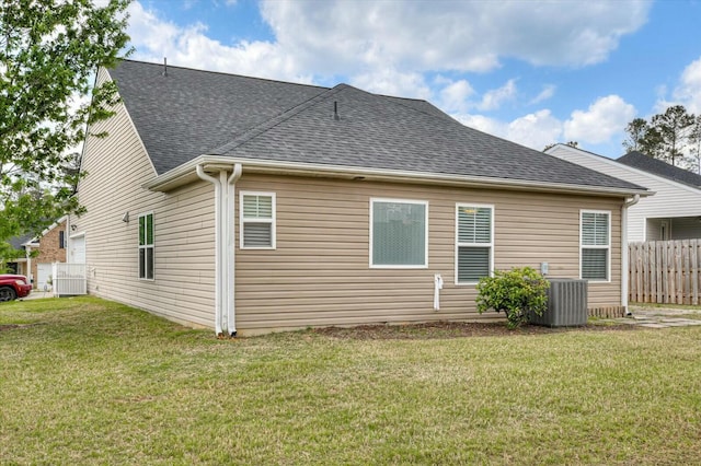 702 Southwick Ave, Grovetown, GA 30813 - back of house with a shingled roof, central AC, fence, and a lawn