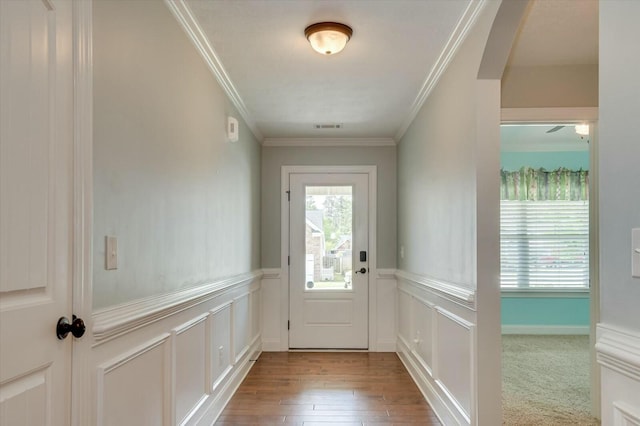 702 Southwick Ave, Grovetown, GA 30813 - doorway featuring visible vents, crown molding, a wainscoted wall, and wood finished floors