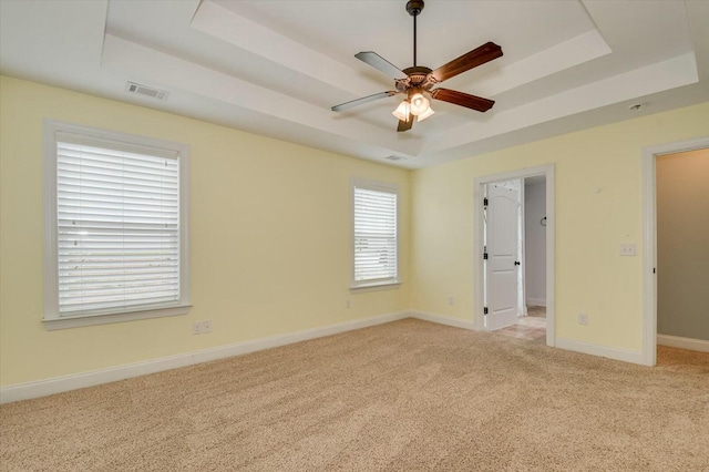 702 Southwick Ave, Grovetown, GA 30813 - unfurnished bedroom featuring a raised ceiling, light colored carpet, baseboards, and visible vents