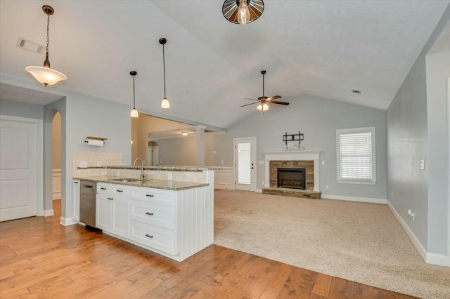 702 Southwick Ave, Grovetown, GA 30813 - kitchen with ceiling fan, arched walkways, white cabinets, visible vents, and a sink