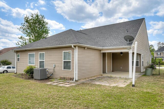702 Southwick Ave, Grovetown, GA 30813 - rear view of house featuring a patio area, central AC unit, ceiling fan, a yard, and a shingled roof