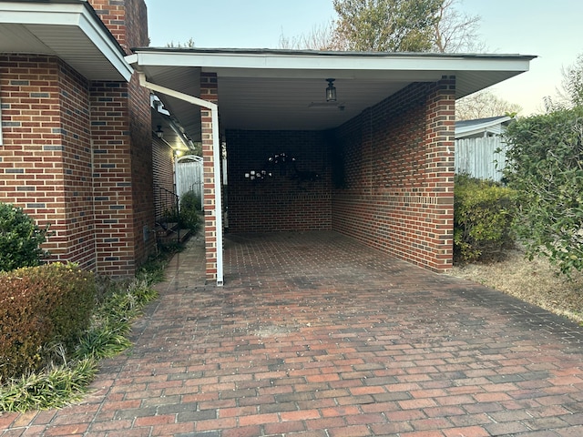 view of vehicle parking featuring a carport