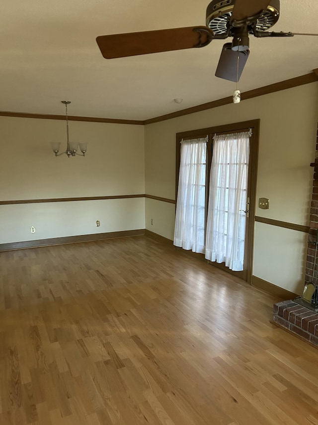 spare room featuring ornamental molding, hardwood / wood-style floors, and ceiling fan