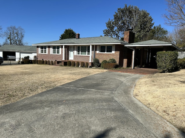 ranch-style home with a carport